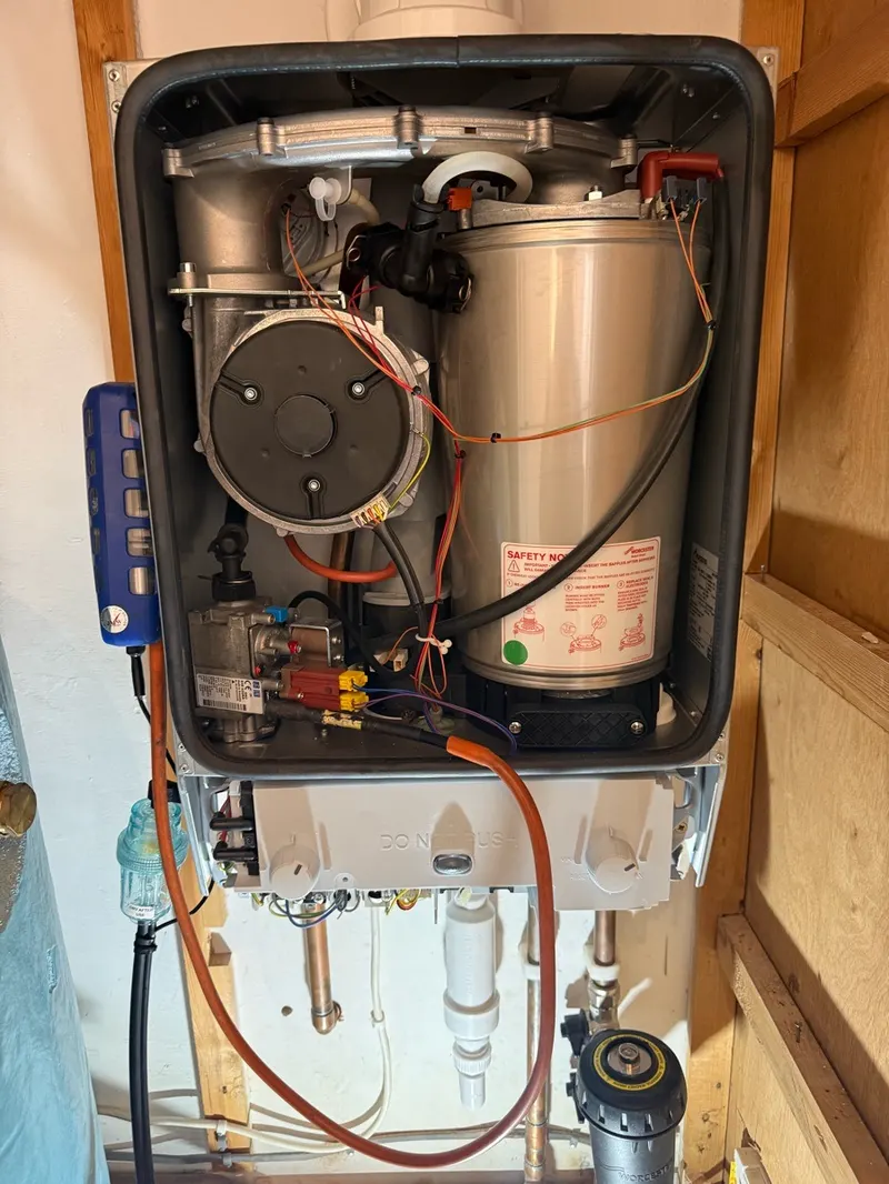 Boiler internals during a repair with a flue gas analyser attached