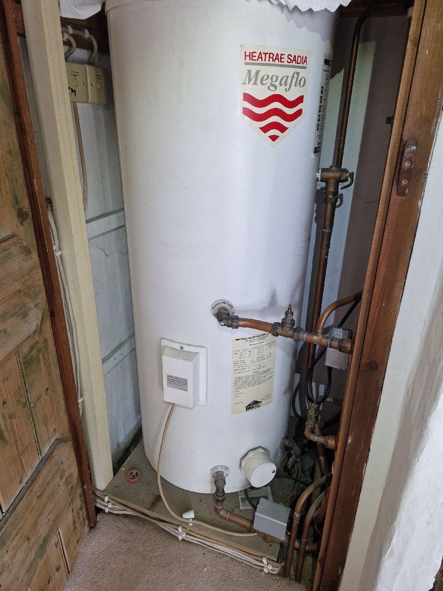 Megaflo unvented cylinder installation in an airing cupboard