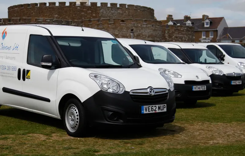 David Osborne Heating's van fleet parked in front of Deal Castle