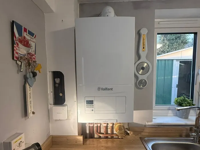 Vaillant boiler installed in a fitted kitchen beside the sink and window
